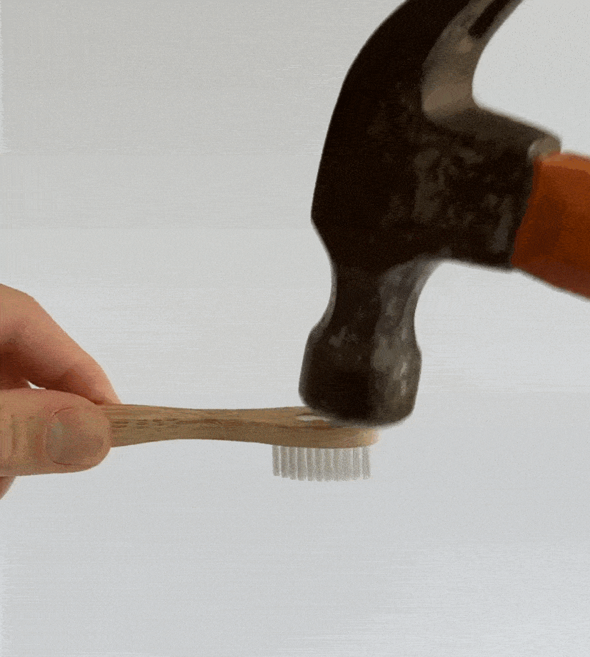 Bamboo Toothbrush With Removable Bristles testing with hammer